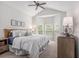 Vaulted ceiling, sunny windows, and a ceiling fan highlight this primary bedroom at 1379 Cottage Dr., Myrtle Beach, SC 29577