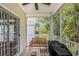Enclosed porch featuring a bench, grill, and a sliding glass door for seamless indoor-outdoor living at 1379 Cottage Dr., Myrtle Beach, SC 29577