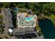 Aerial view of community pool, splash pad and landscaping near the lake at 14290 Ocean Hwy. # 312, Pawleys Island, SC 29585