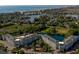 Beautiful aerial view of condo complex with a pool, nearby lake, and the ocean in the background at 14290 Ocean Hwy. # 312, Pawleys Island, SC 29585