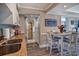 Spacious kitchen featuring stainless steel appliances, granite counters, and view into the dining area at 14290 Ocean Hwy. # 312, Pawleys Island, SC 29585