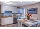 Well-equipped kitchen with stainless appliances, granite countertops, and a cozy dining area at 14290 Ocean Hwy. # 312, Pawleys Island, SC 29585