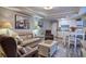 Cozy living room blending seamlessly into the kitchen, featuring comfortable seating and modern appliances at 14290 Ocean Hwy. # 312, Pawleys Island, SC 29585