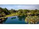 Relaxing water view of the community pond, palm trees and benches at 14290 Ocean Hwy. # 312, Pawleys Island, SC 29585