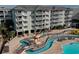 A view of the multi-tiered pool and lazy river winding around the complex at 14290 Ocean Hwy. # 312, Pawleys Island, SC 29585