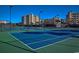 Well-maintained tennis courts with views of the surrounding landscaping and nearby condo buildings at 14290 Ocean Hwy. # 312, Pawleys Island, SC 29585