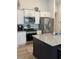 Well-equipped kitchen boasting stainless steel appliances, granite countertops, and a spacious island at 1565 Jardine Loop, Little River, SC 29566