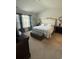 Serene main bedroom with a cozy bed, plush carpet, and natural light, offering a relaxing retreat at 1565 Jardine Loop, Little River, SC 29566