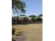 A fenced community playground with play equipment under green canopies at 1565 Jardine Loop, Little River, SC 29566