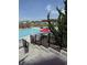 Community swimming pool, lounging and dining with residential homes in background at 1565 Jardine Loop, Little River, SC 29566