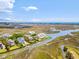 Overhead shot of waterfront homes with docks, nestled in a serene coastal landscape with amazing ocean views at 172 Colony Point Dr., Georgetown, SC 29440