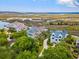 Aerial view of three luxury homes overlooking the marsh, offering privacy and stunning natural beauty at 172 Colony Point Dr., Georgetown, SC 29440