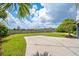 Expansive backyard featuring a patio, well-maintained lawn, and scenic views beyond the black fence at 172 Colony Point Dr., Georgetown, SC 29440