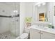 Bright bathroom with glass shower, black and white tile, and a white vanity with carrara marble countertop at 172 Colony Point Dr., Georgetown, SC 29440