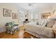 Comfortable bedroom with wood floors, shuttered windows, a ceiling fan, and a chair with floral pattern at 172 Colony Point Dr., Georgetown, SC 29440