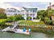 Elegant waterfront home featuring multiple balconies and a private dock at 172 Colony Point Dr., Georgetown, SC 29440
