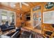 Spacious living room with wood paneling, ceiling fan, comfortable seating and an open view to the kitchen at 172 Colony Point Dr., Georgetown, SC 29440