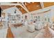 Expansive living room boasts a wooden ceiling, neutral furniture, and open access to other living areas at 172 Colony Point Dr., Georgetown, SC 29440