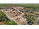 An aerial view highlights the community's lush surroundings with serene bodies of water and tree coverage at 178 Six Mile Creek Dr., Georgetown, SC 29440