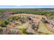 A breathtaking aerial showcases a neighborhood nestled among mature trees and pond at 178 Six Mile Creek Dr., Georgetown, SC 29440