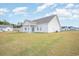 Spacious backyard with a covered patio, a green lawn and a well-maintained exterior at 178 Six Mile Creek Dr., Georgetown, SC 29440