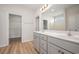 Bathroom featuring a double vanity, an open doorway, and modern fixtures at 178 Six Mile Creek Dr., Georgetown, SC 29440