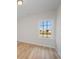 Bedroom features wood floors, a window overlooking a pond, and neutral walls at 178 Six Mile Creek Dr., Georgetown, SC 29440