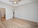 Bright bedroom with tray ceilings, wood floors, a ceiling fan, and white paint at 178 Six Mile Creek Dr., Georgetown, SC 29440