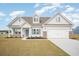 Charming one-story home boasts a two-car garage, manicured lawn, and a welcoming entrance at 178 Six Mile Creek Dr., Georgetown, SC 29440