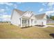 Angle shot of this beautiful one-story home showcasing its manicured lawn at 178 Six Mile Creek Dr., Georgetown, SC 29440