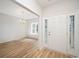 Bright foyer featuring hardwood floors and a view into the dining area at 178 Six Mile Creek Dr., Georgetown, SC 29440