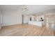 Open concept living room featuring hardwood floors, fan, with views of the kitchen and entry foyer at 178 Six Mile Creek Dr., Georgetown, SC 29440