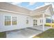 A covered outdoor patio is visible with ceiling fan, view of yard and windows to the home's interior at 178 Six Mile Creek Dr., Georgetown, SC 29440
