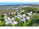 Stunning aerial view of a coastal community with lush greenery and the ocean in the background at 18 Coastal Breeze Trail, Pawleys Island, SC 29585