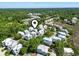 Scenic aerial view of a charming neighborhood surrounded by lush green trees and serene landscapes at 18 Coastal Breeze Trail, Pawleys Island, SC 29585