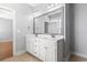 Bathroom featuring a double sink vanity, framed mirror and modern fixtures at 18 Coastal Breeze Trail, Pawleys Island, SC 29585