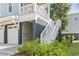 Charming home exterior with a private entrance and well-maintained landscaping at 18 Coastal Breeze Trail, Pawleys Island, SC 29585