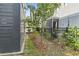 Narrow side yard with manicured garden bed and fence at 18 Coastal Breeze Trail, Pawleys Island, SC 29585
