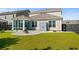 Landscaped backyard with patio, fire pit, storage shed, and sunroom at 1808 Zodiac Court, Myrtle Beach, SC 29577