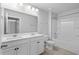 Bright bathroom with double vanity, full mirror, and shower-tub combo at 1808 Zodiac Court, Myrtle Beach, SC 29577