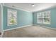 A sunlit bedroom offers plush carpeting, neutral walls and large windows at 1808 Zodiac Court, Myrtle Beach, SC 29577