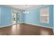 A dining room featuring hardwood floors, blue walls and a chandelier at 1808 Zodiac Court, Myrtle Beach, SC 29577