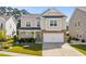 Charming two-story home with a two-car garage, well-maintained lawn, and inviting curb appeal at 1808 Zodiac Court, Myrtle Beach, SC 29577