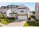 Charming two-story home featuring a two-car garage and beautifully landscaped front yard at 1808 Zodiac Court, Myrtle Beach, SC 29577