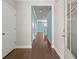 This hallway features hardwood floors and leads to several rooms at 1808 Zodiac Court, Myrtle Beach, SC 29577