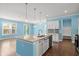 Open-concept kitchen featuring a center island, stainless steel appliances, and hardwood floors at 1808 Zodiac Court, Myrtle Beach, SC 29577