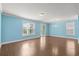 Bright living room with hardwood floors and large windows at 1808 Zodiac Court, Myrtle Beach, SC 29577