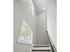 Bright stairway with windows, modern railing, and fresh white paint provides natural light at 1808 Zodiac Court, Myrtle Beach, SC 29577