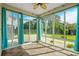 Bright sunroom with large windows offering ample sunlight and serene backyard views at 1808 Zodiac Court, Myrtle Beach, SC 29577