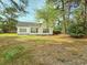 A private backyard with mature trees and ample space for recreation and relaxation at 185 Lander Dr., Conway, SC 29526